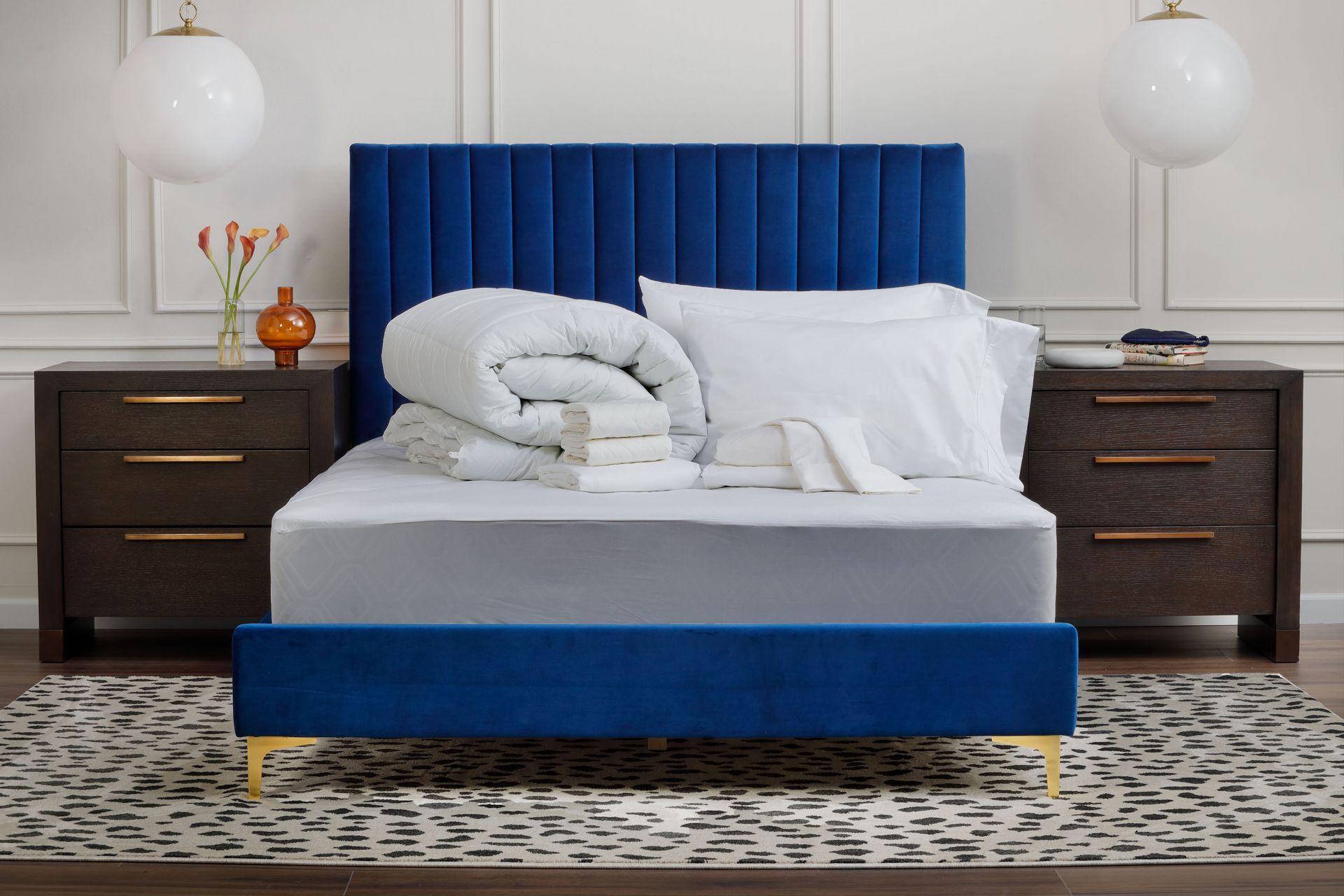 Couple holding pillows over bed