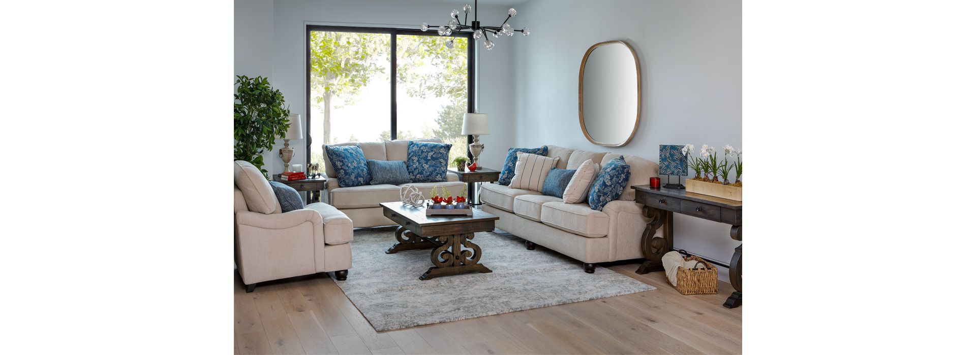 Cream Colored Sofa Set with Blue Floral Pillows in Living Room