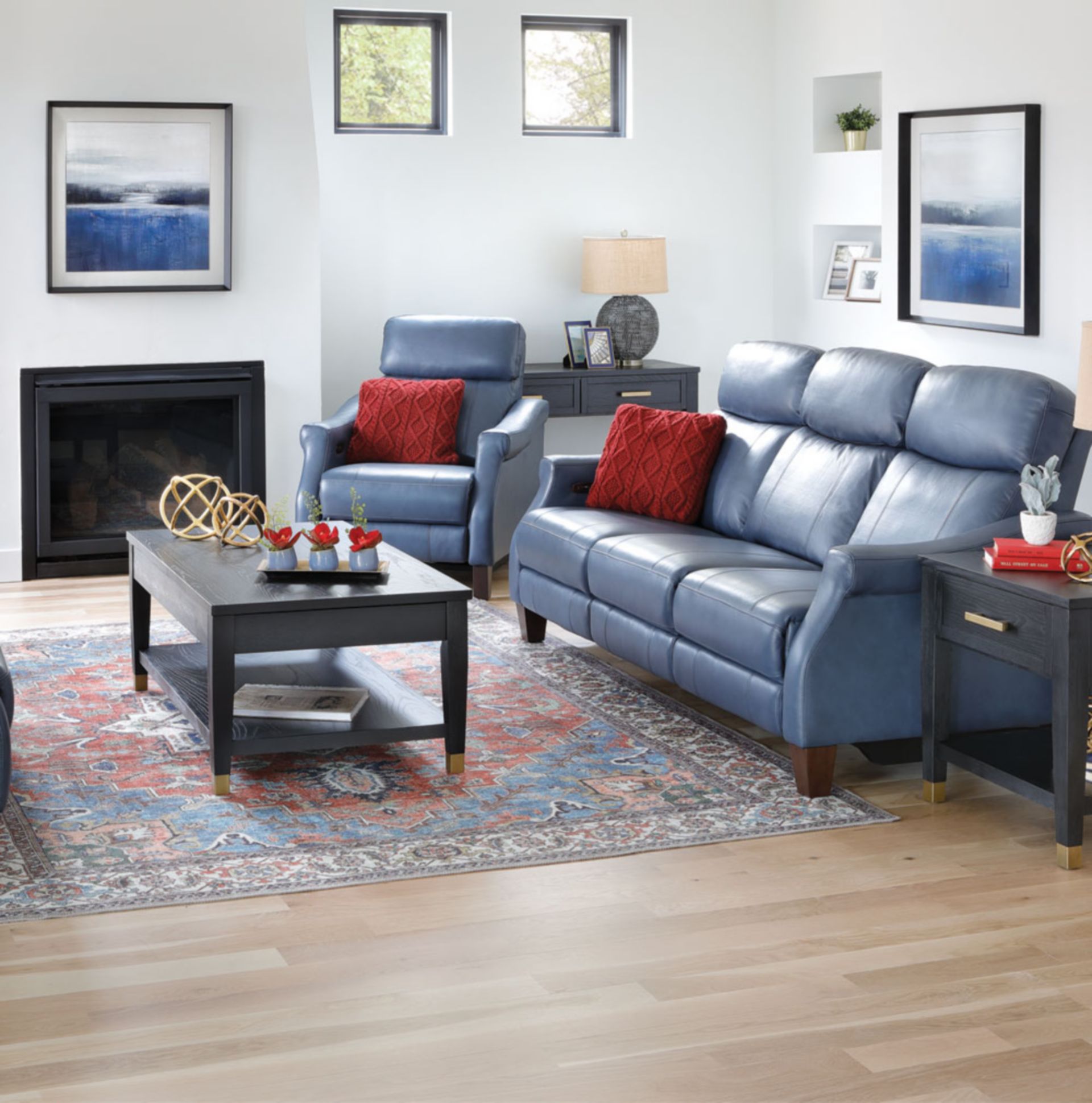 Astra Sofa Group. Blue leather Sofa, Love seat, and chair in home.