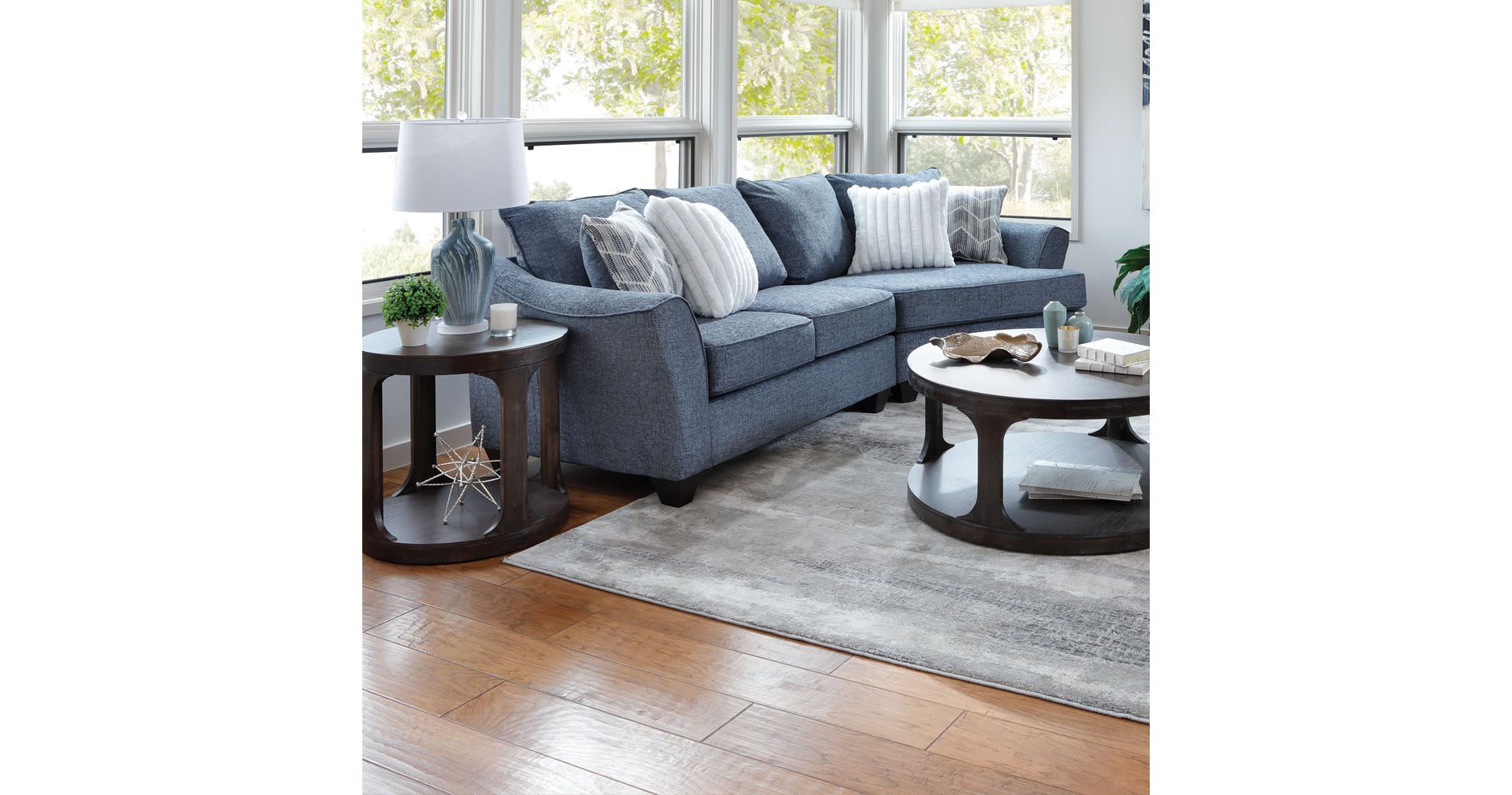 Light Grayish tan L shaped sectional with curved chaise 