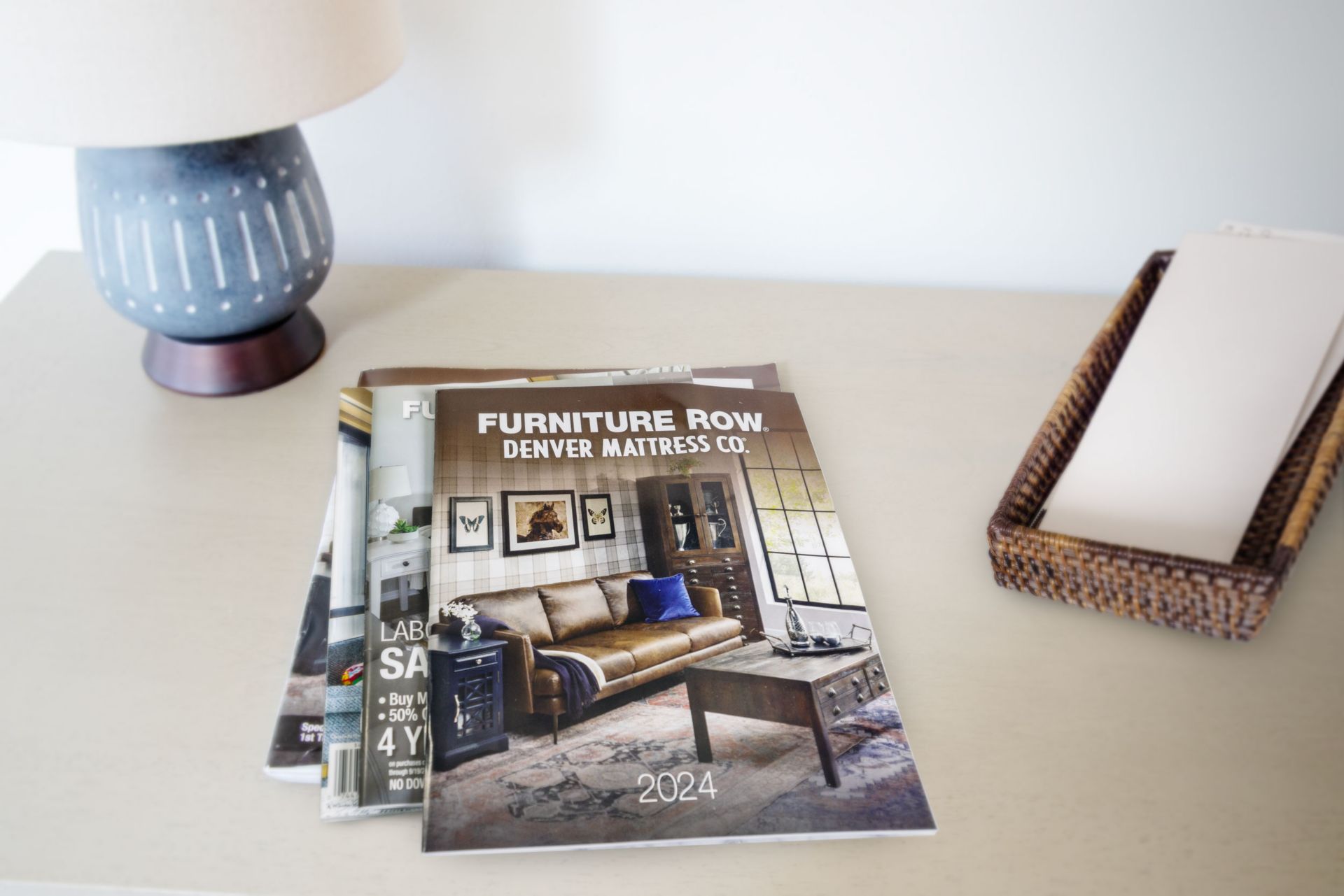 2024 Furniture Row Annual Catalog Sitting atop Entryway Table