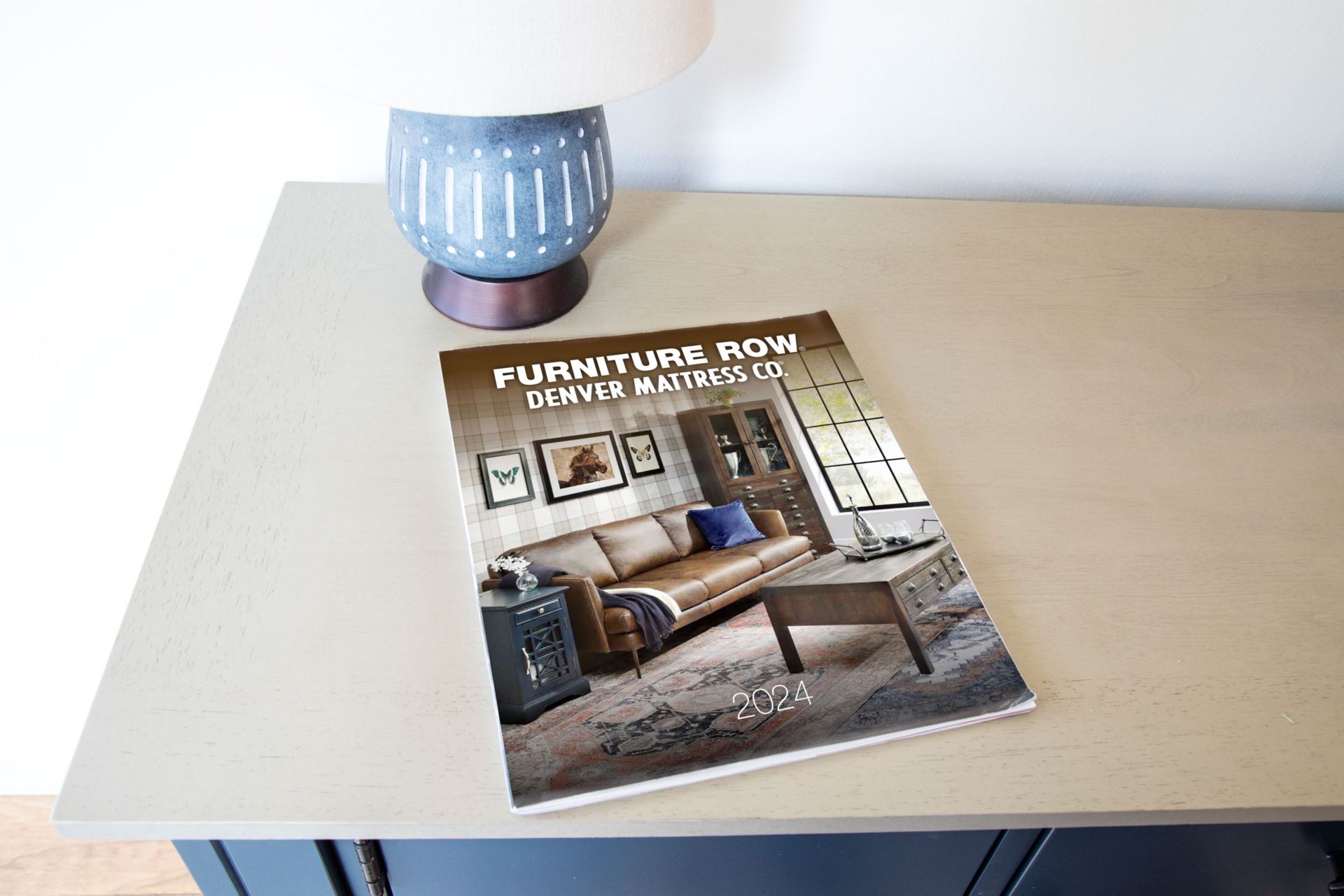 Furniture Row 2024 Annual Catalog sitting on Entryway Table