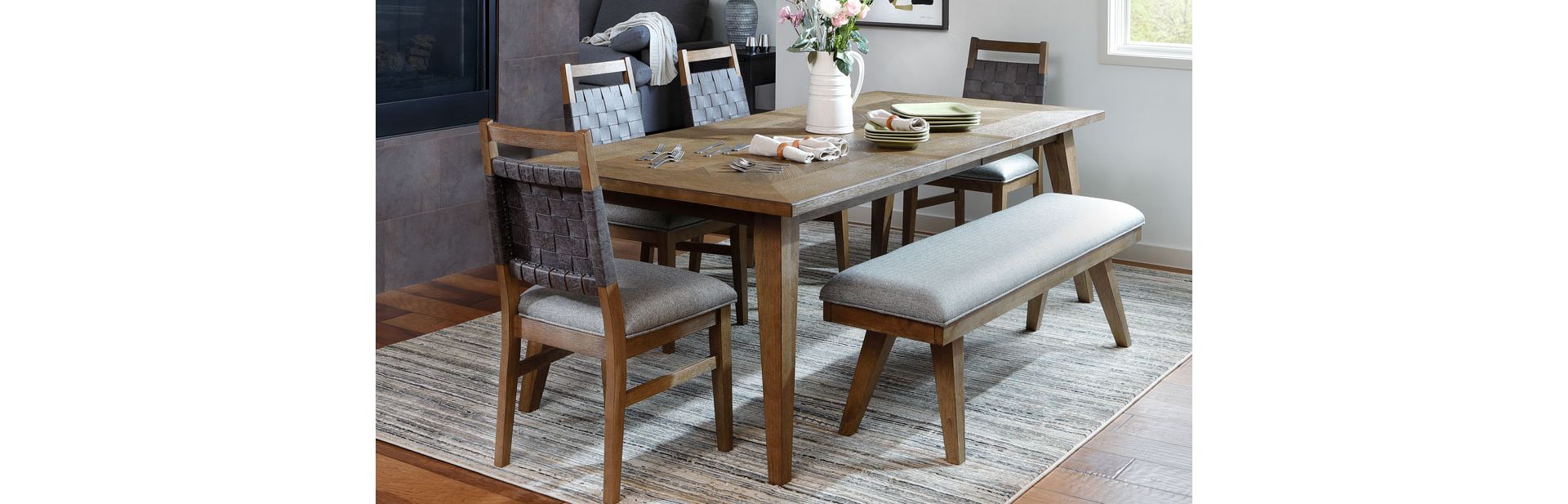 Wooden Dining Table With Leather Woven Chair Backs in Dining Room