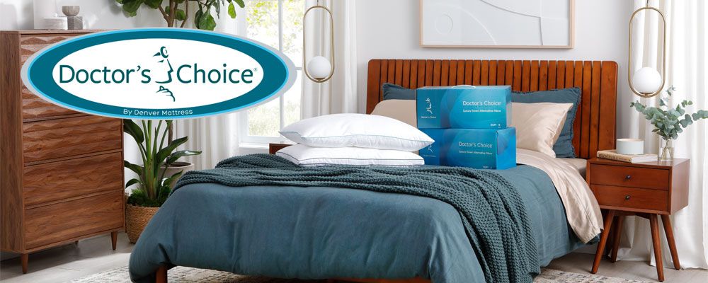 Two Doctor's Choice Pillows on Bed with Doctors Choice by Denver Mattress Logo. 