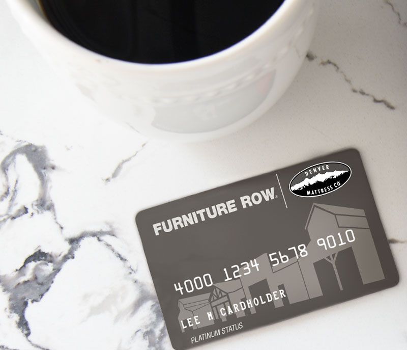 Furniture Row Credit Card Next to computer with coffee cup