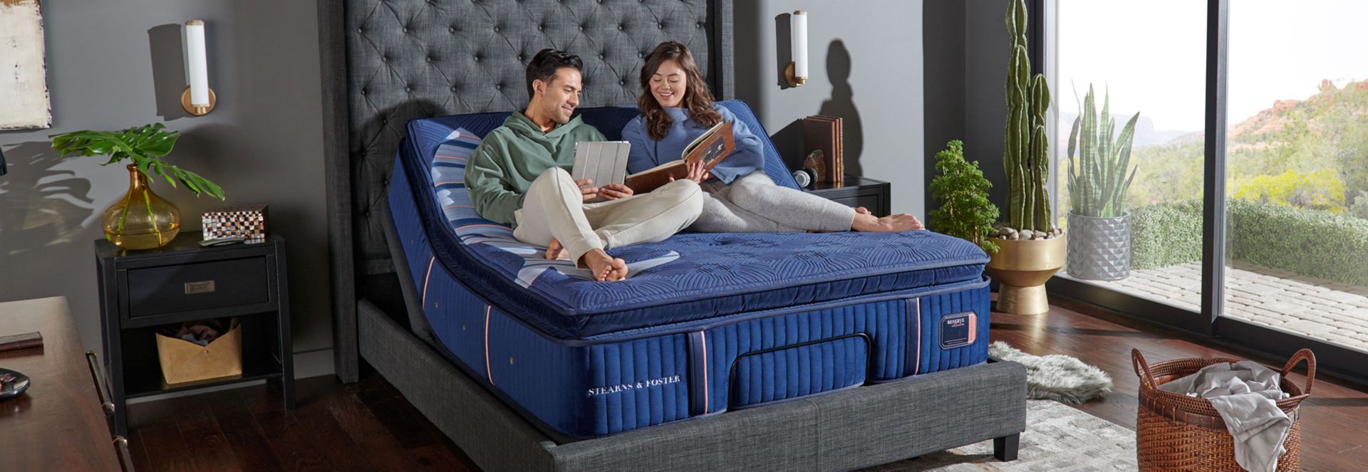 Couple Relaxing on Stearns and Foster Reserve Mattress in Bedroom with Floor to Ceiling Windows