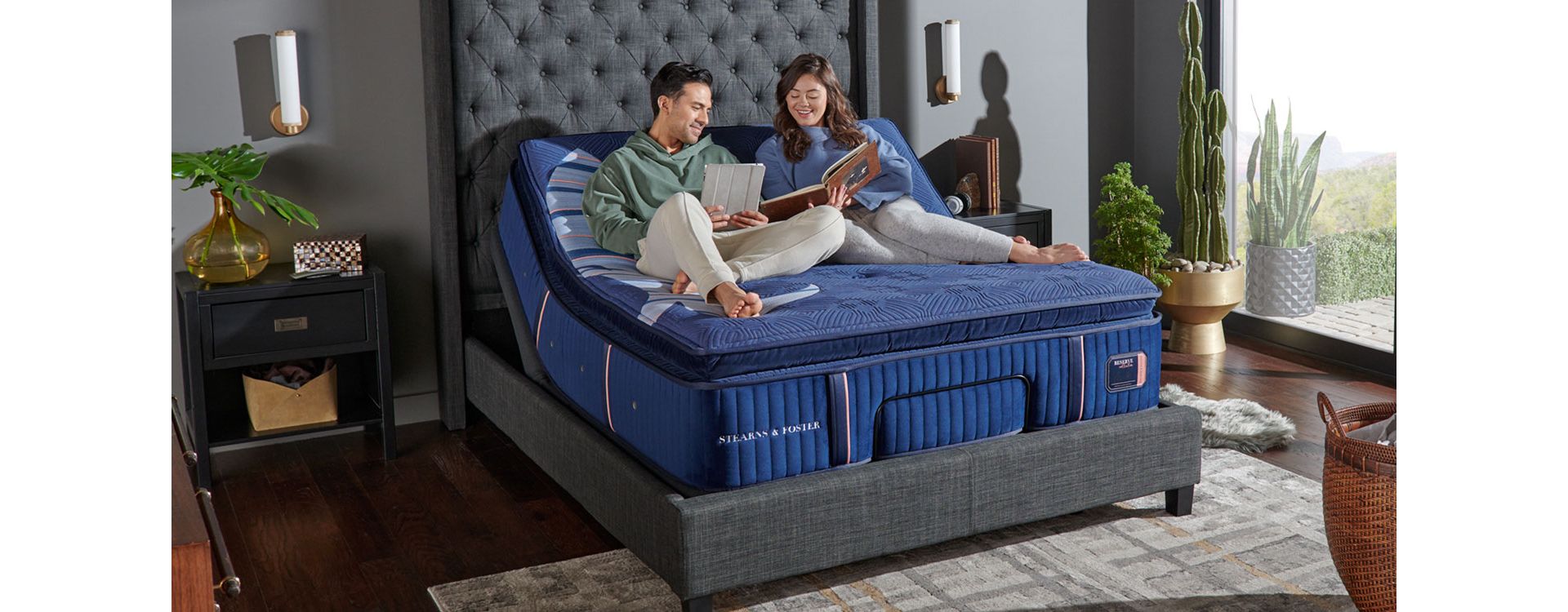 Couple Relaxing on Stearns and Foster Reserve Mattress in Bedroom with Floor to Ceiling Windows