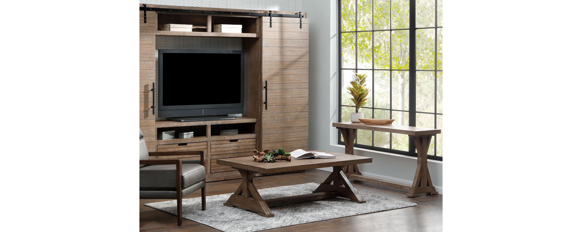 Mocha mousse colored entertainment center, coffee table, and sofa table in living room