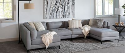 Gray Leather Sectional with Metal feet in Room